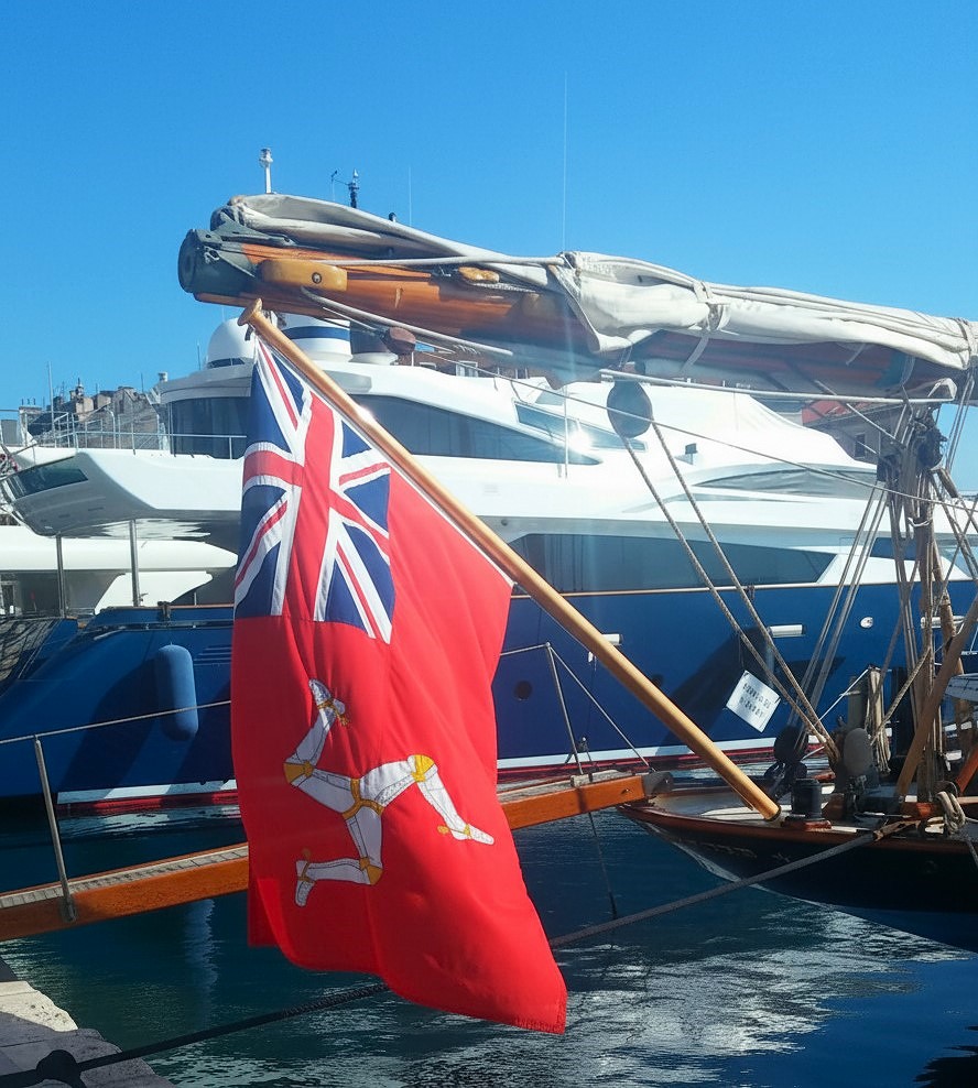 Vintage Yacht with The Manx Red Ensign